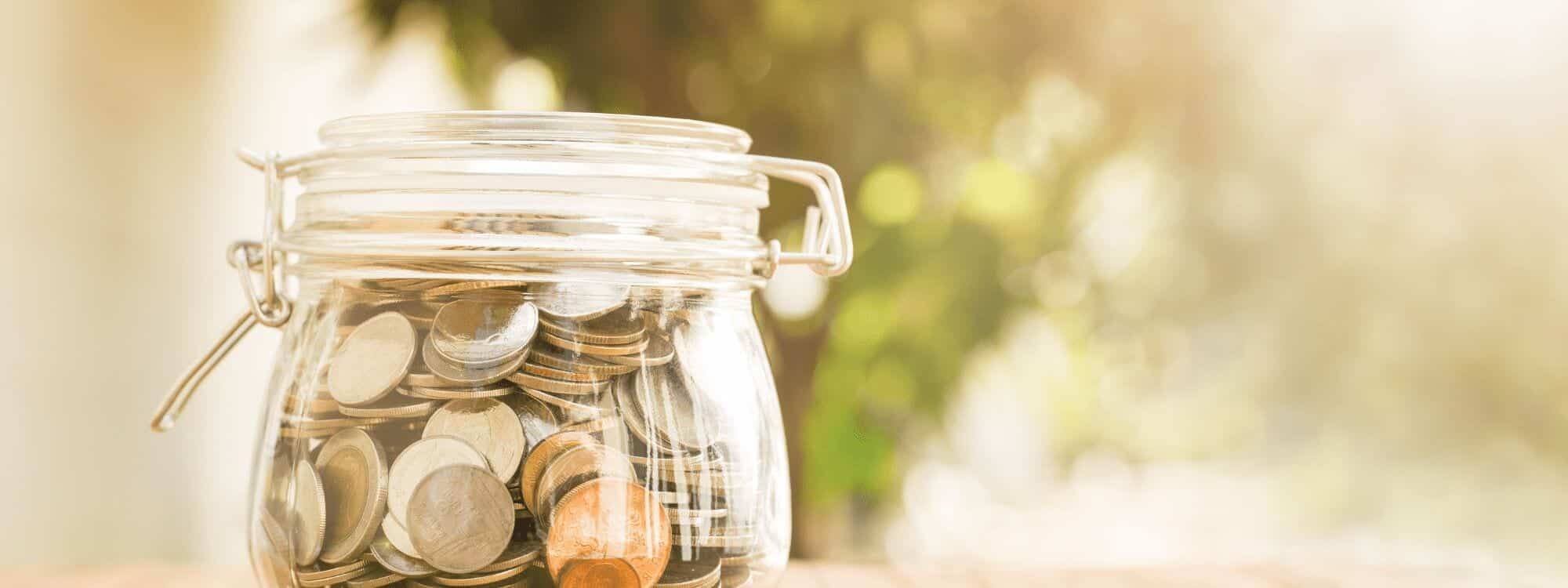 A saving jar full of coins shows the benefits of booking & paying for Southpac courses and Diplomas before tax time.